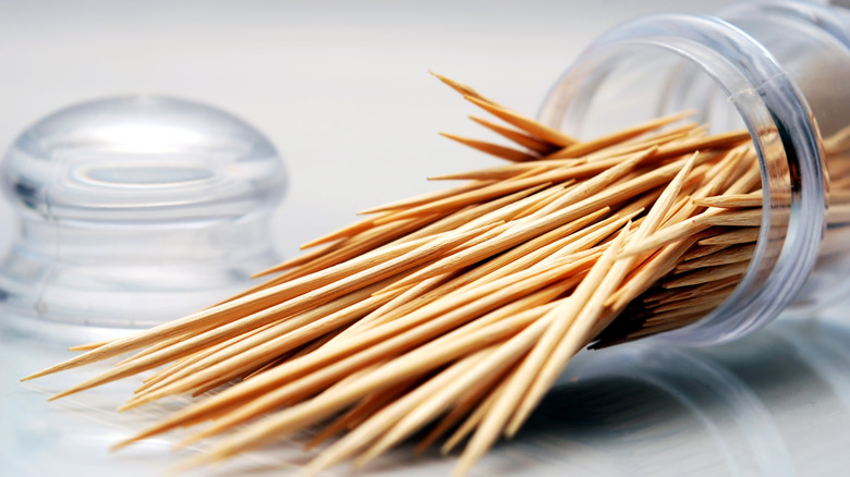 Toothpicks spilled out on the counter
