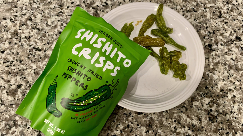 Bag of Trader Joe's shishito crisps with some on plate