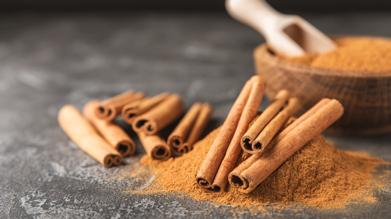 Cinnamon sticks on a pile of spice