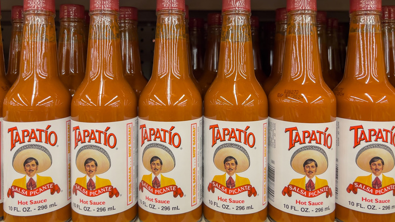 Row of bottles of Tapatio hot sauce