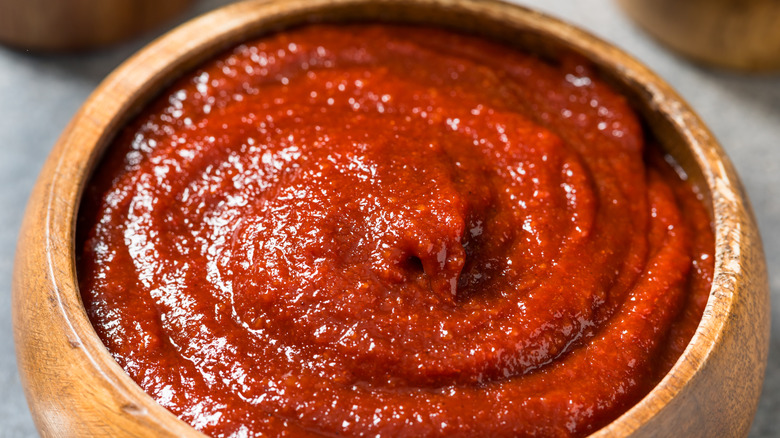 Wooden bowl of spicy chili paste
