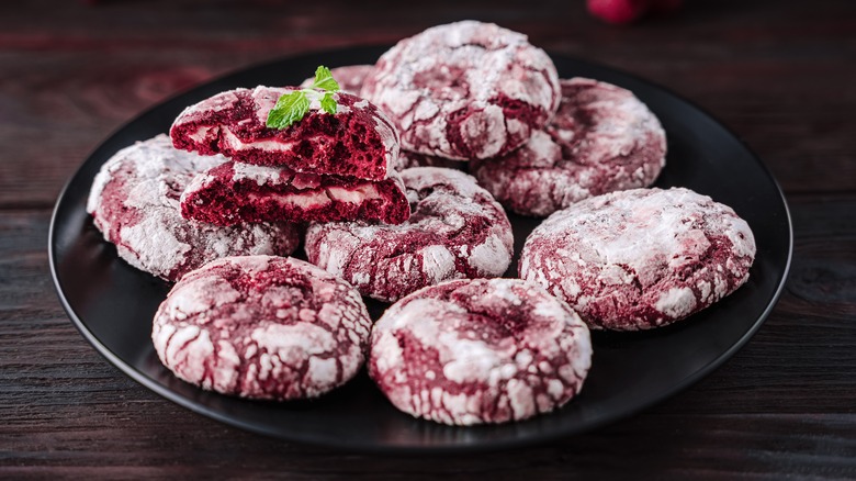 red cookies decorated with powdered sugar