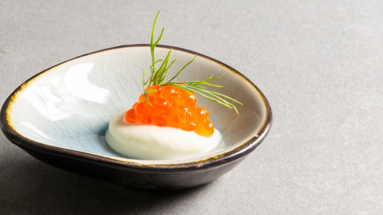 Dollop of crème fraîche and roe in bowl