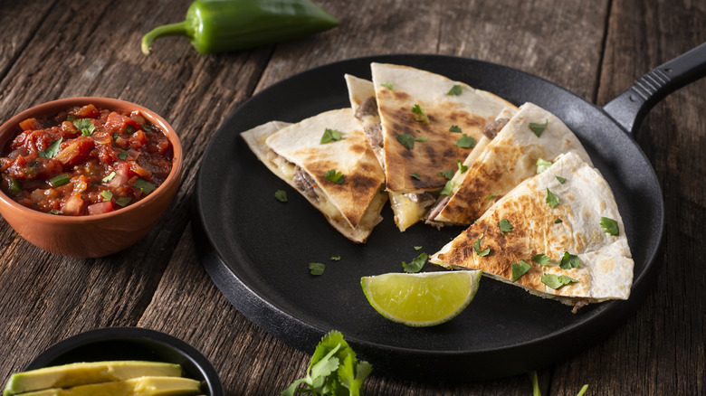 quesadilla on plate wth lime