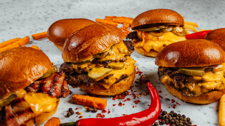 Group of stacked smash burgers with cheese
