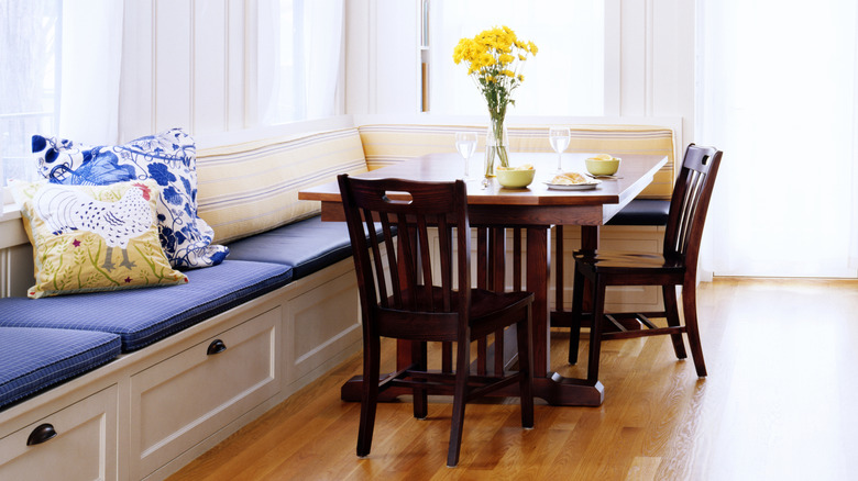 Home kitchen with installed banquette seating