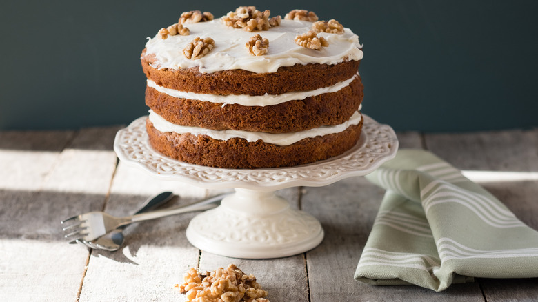 Carrot cake topped with walnuts