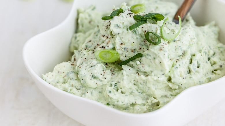 Herbed cream cheese topped with scallions.