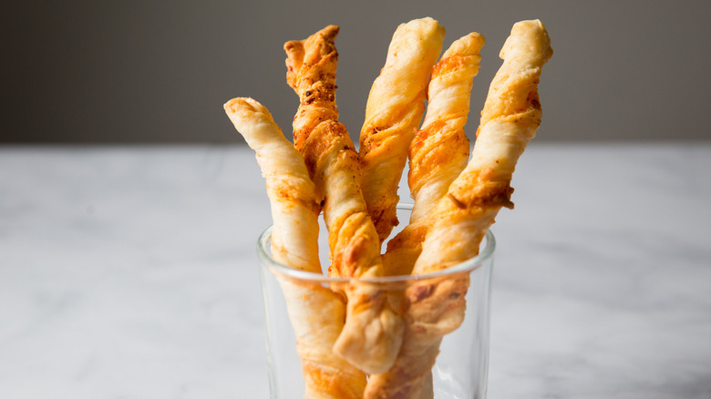 cheese straws in clear glass