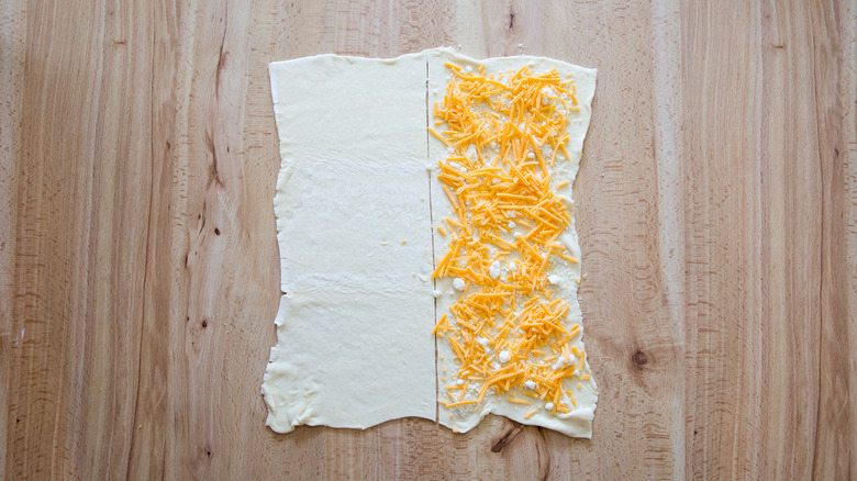 shredded cheese on puff pastry