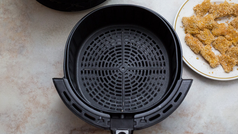 greased air fryer on table