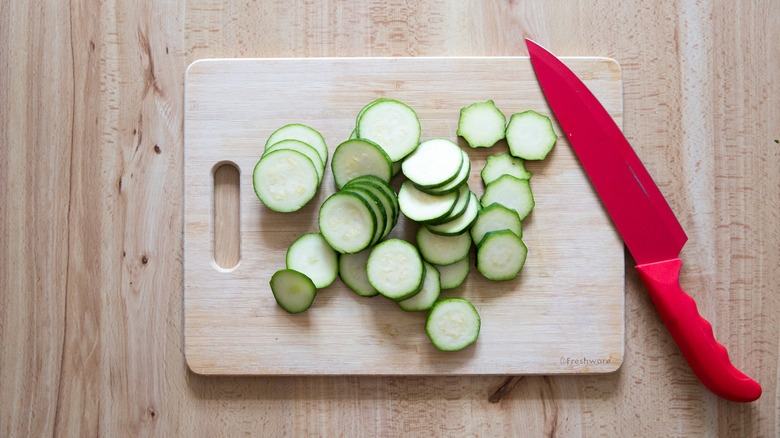 sliced zucchini on cutting board