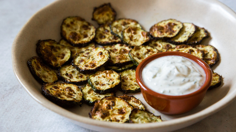 zucchini chips served on table