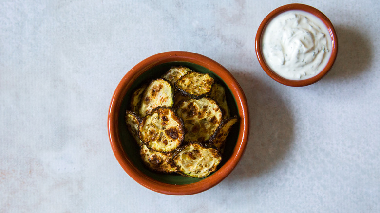 zucchini chips served on table