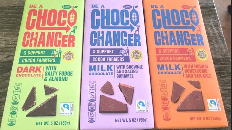 Three varieties of Choceur's Choco Changer chocolate bars in green, purple, and orange packages