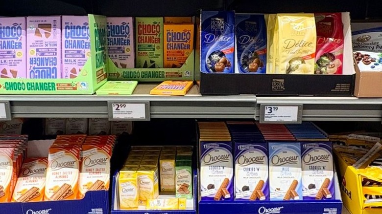 Aldi chocolate bar section filled with assorted chocolate bars and candies
