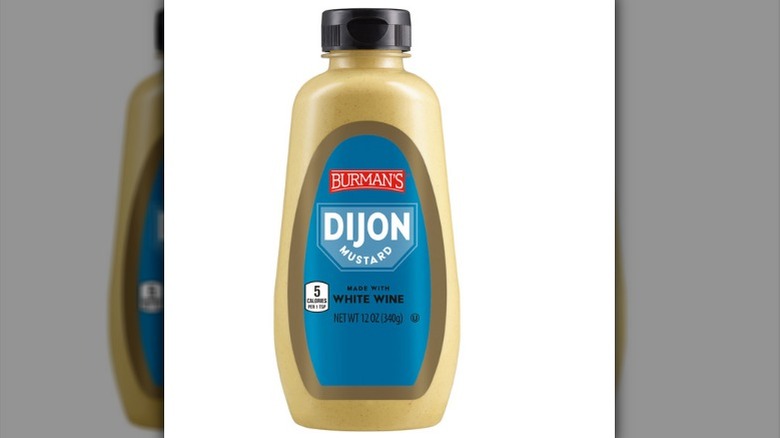 A bottle of Burman's Dijon mustard made with white wine.