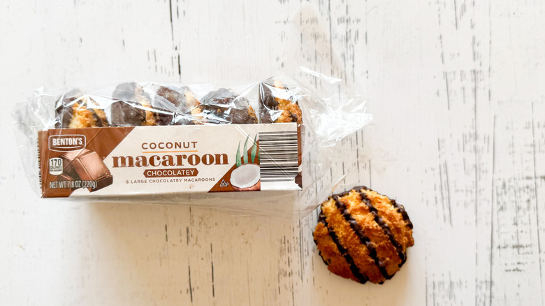 Benton's coconut macaroons package with cookie on a white wooden surface