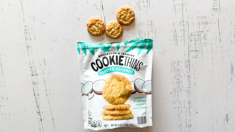 Benton's toasted coconut cookies and bag on a white wooden surface