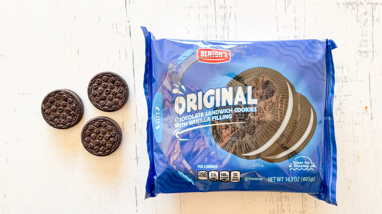 Benton's original chocolate sandwich cookies and package on a white wooden surface