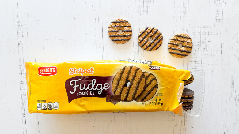 Benton's striped fudge cookies and package on a white wooden surface