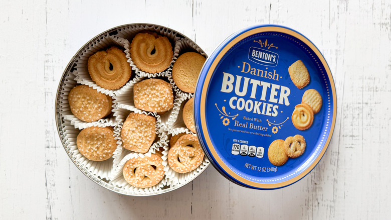Benton's Danish butter cookies in a container on a white wooden surface