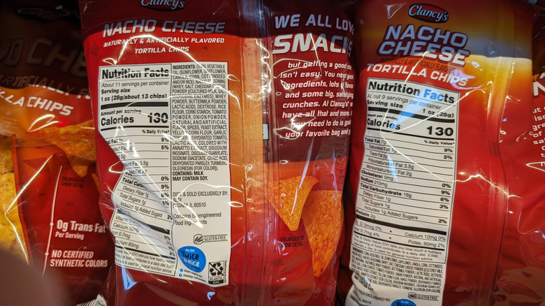 Back of tortilla chip packets at Aldi listing ingredients and serving sizes