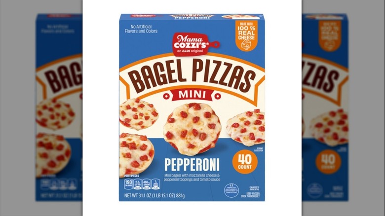 A blue box of Aldi Mama Cozzi's Pizza Kitchen Mini Pizza Bagels on a white background