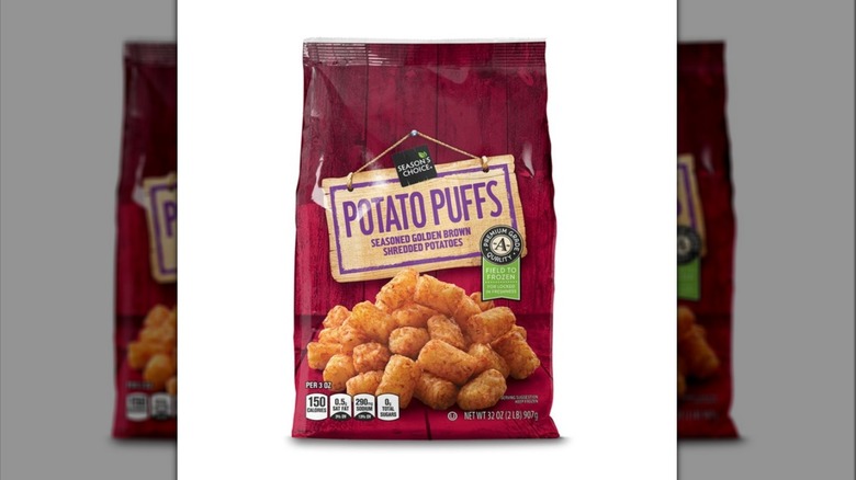 A red bag of Season's Choice Potato Puffs from Aldi on a white background