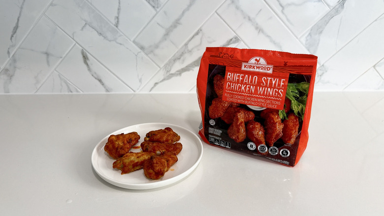 Kirkwood Buffalo style chicken wings on a plate with product bag alongside