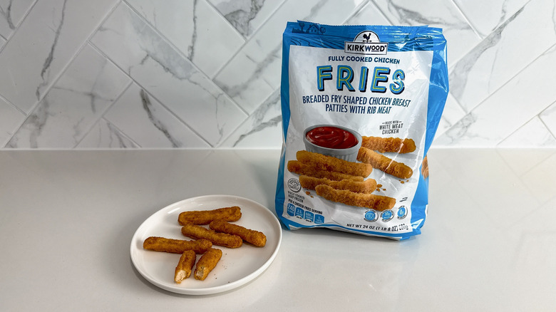 Aldi chicken fries on a plate with product bag alongside