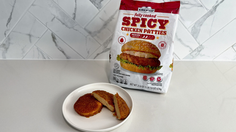 Kirkwood chicken patties on a plate with product bag alongside