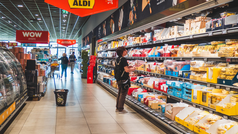 Aldi shopper looking at produce