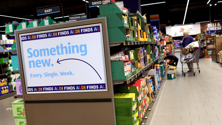 Aldi shopper standing in aisle