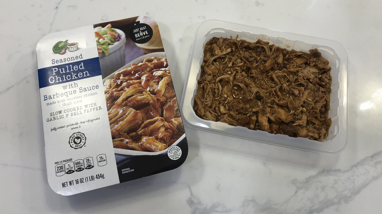Aldi Park Street Deli pulled BBQ chicken in plastic tray.
