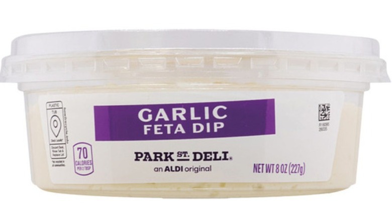 Garlic and feta dip on a white background