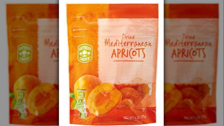 Bag of dried apricots on a white background