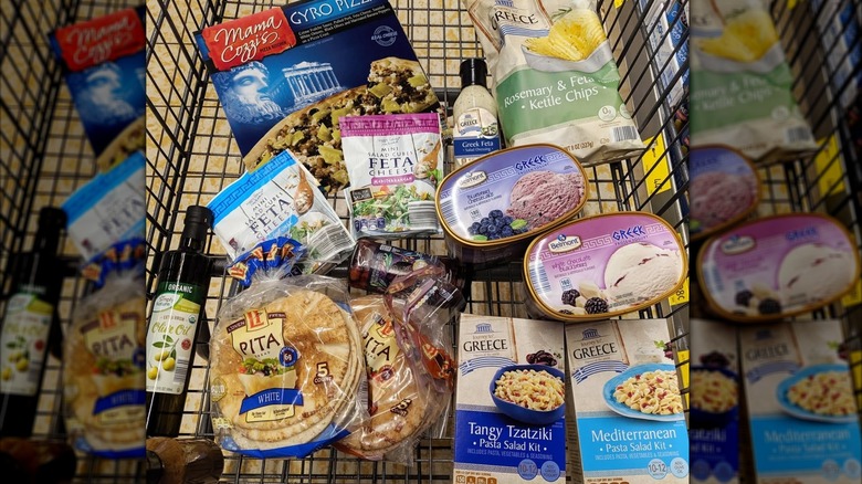 cloe up of Aldi cart with Greek products, mirrored image