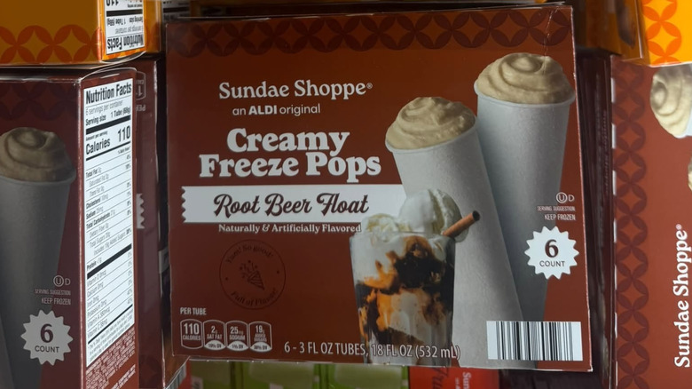 Boxes of Sundae Shoppe Creamy Freeze Pops Root Beer Float on display at an Aldi store