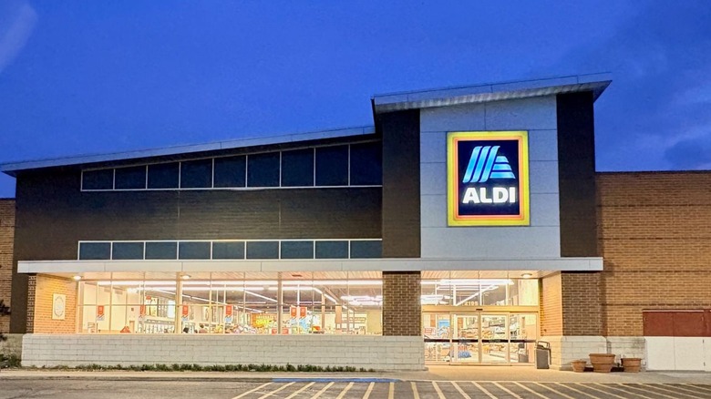 Aldi store with lit-up sign at night
