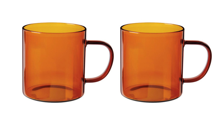 Two Crofton glass coffee mugs in amber color.
