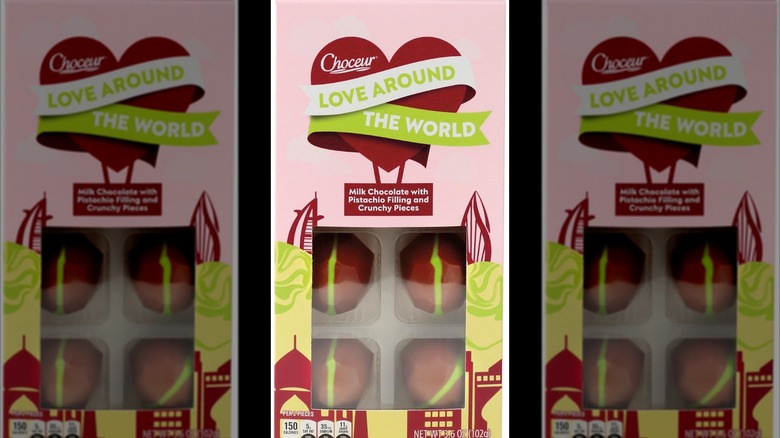 Pink and green package of chocolates with pistachios