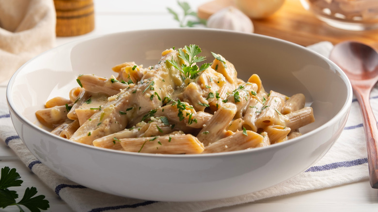 A bowl of fettucine alfredo with black pepper