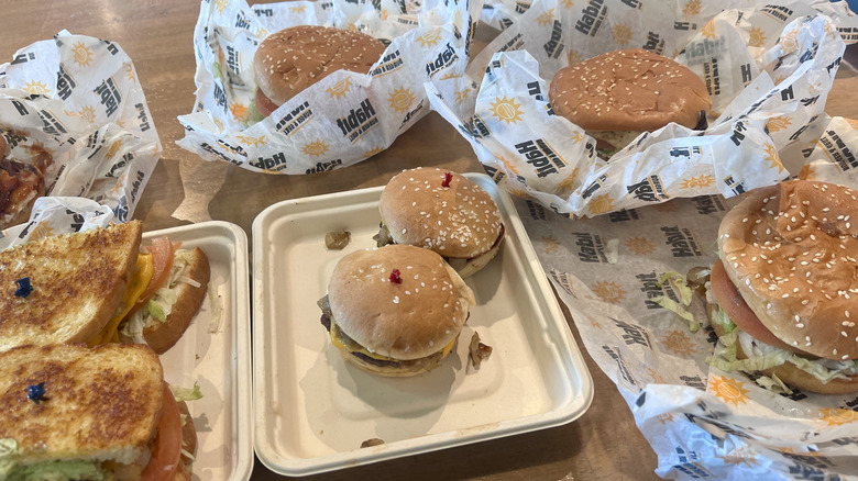 Various burgers on a table