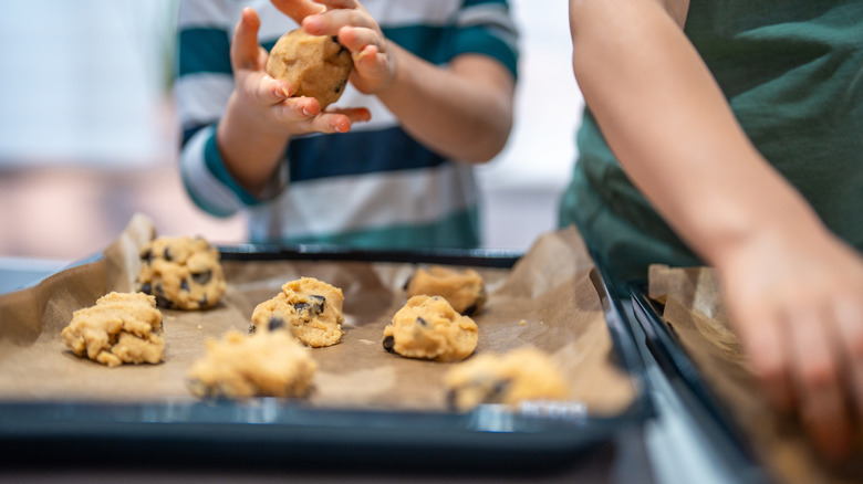 kid making cookie dough