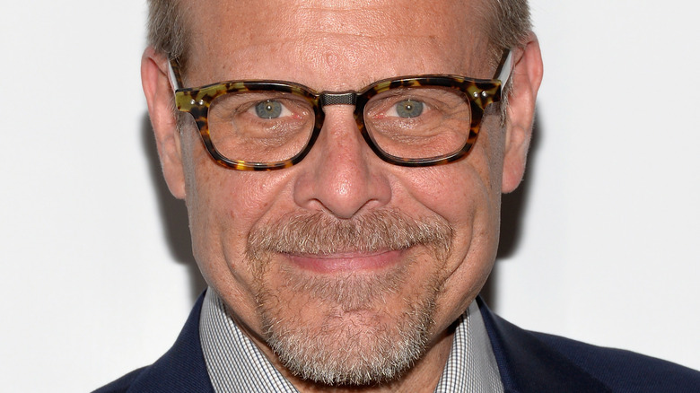 Close up of Alton Brown smiling in glasses