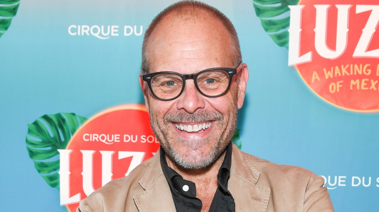 Alton Brown smiling at an event