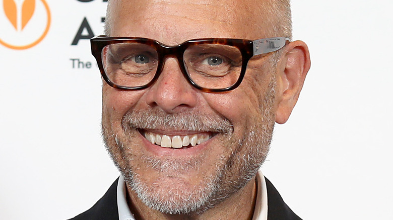 Alton Brown close-up smiling with glasses