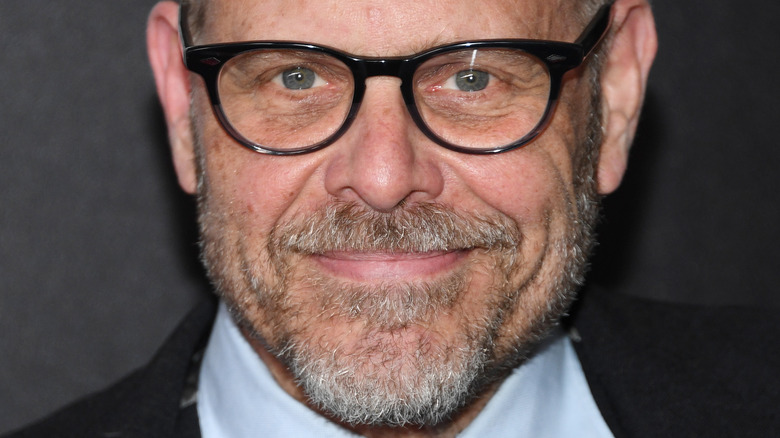 alton brown smiling with glasses