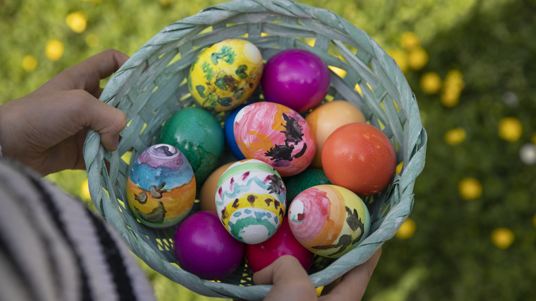 Basket of colorful hand-painted Easter eggs